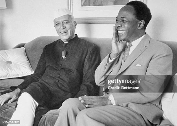Indian Prime Minster Jawaharlal Nehru, and Ghana Premier Kwame Nkrumah enjoy a laugh here at Nehru's suite in the Hotel Carlyle. After the meeting...