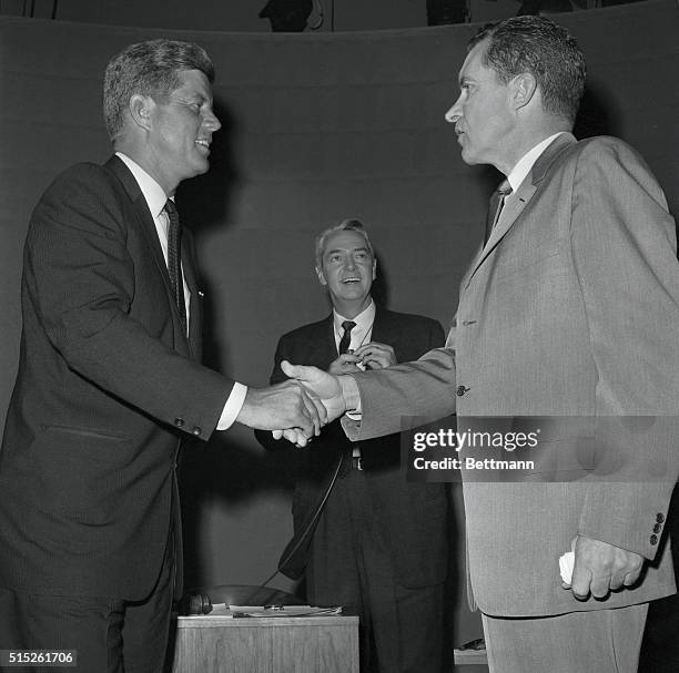 Senator John F. Kennedy and Vice President Richard Nixon shake hands in TV studio here 9/26 after meeting in the first of their nationally televised...