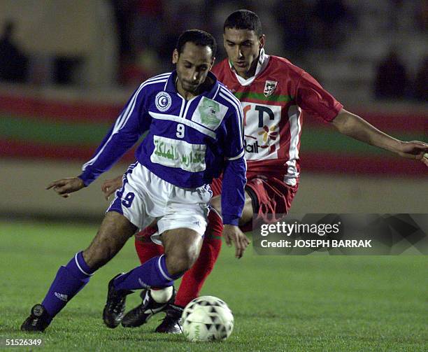 Saudi al-Hilal player Sami al-Jaber controls the ball with Tunisia's al-Malaab player Anis al-Ayari behind him during their Arab Cup Winners Cup...