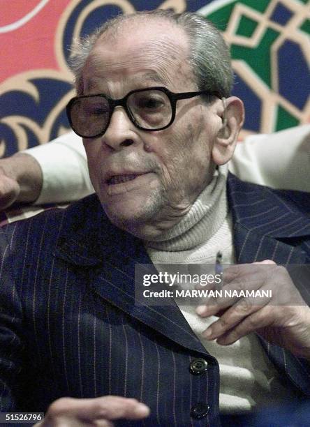 File photo dated 13 December 2000 shows Egyptian novelist Naguib Mahfouz smoking a cigarette during his birthday party in Cairo. Mahfouz, born in...