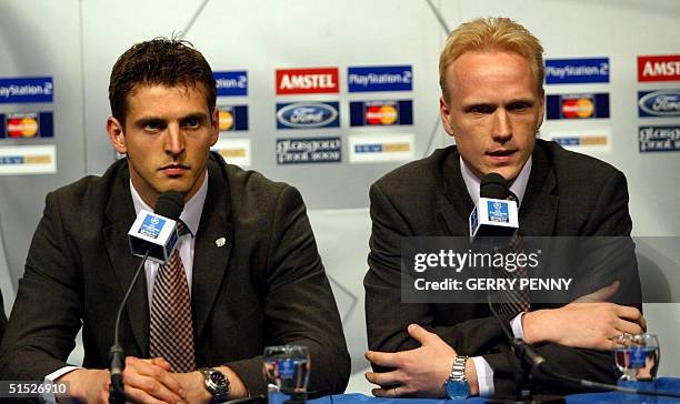 Bayer Leverkusen goalkeeper Hans-Joerg Butt and captain Carsten Ramelow answer journalists' questions during the pre-match press conference at...