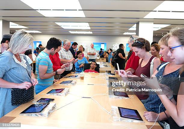 Customers check out the new iPhone 6 models at the Apple Store at Westfield Topanga shopping center in Canoga Park, California, on September 19, 2014.