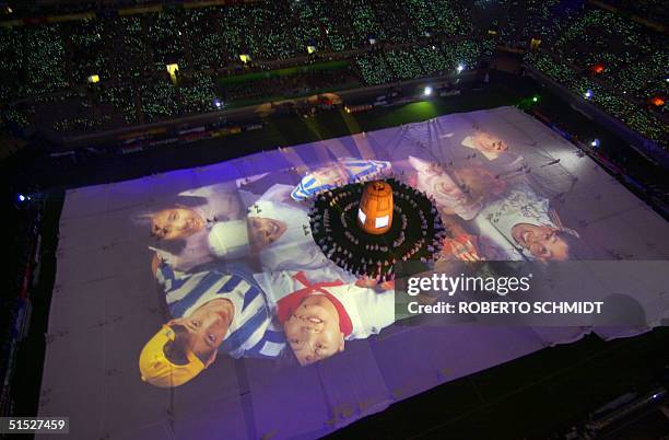 The images of children from around the world are seen on the pitch during the opening ceremony of the 2002 FIFA World Cup Korea/Japan in Seoul, 31...