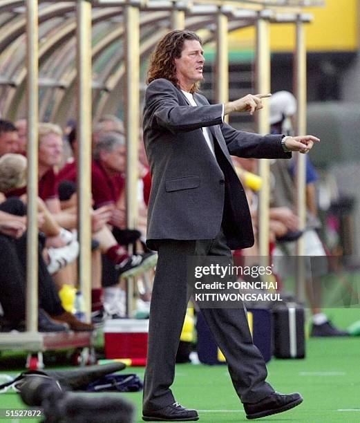 Senegal coach Bruno Metsu signals to his players during their Group A match against Denmark at the 2002 FIFA World Cup Korea/Japan in Daegu, 06 June...