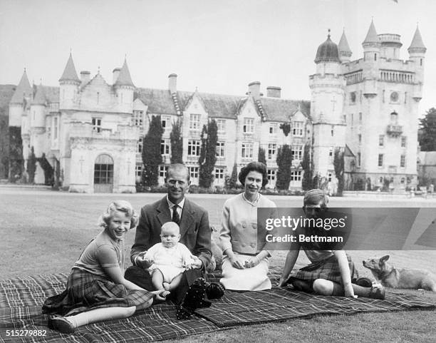 Queen Elizabeth II and Prince Philip, Duke of Edinburgh with their children, Prince Andrew , Princess Anne and Charles, Prince of Wales sitting on a...