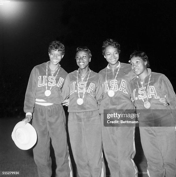 Rome, Italy- Members of America's victorious women's 400-meter relay team wear smiles and Olympic gold medals. Pictured are: Wilma Rudolph of...