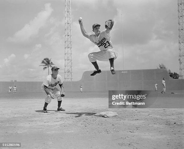 Photo shows Don Zimmer making the double play with Pee Wee Reese at shortstop, who feed him the ball. Don't be surprised that on opening day the...