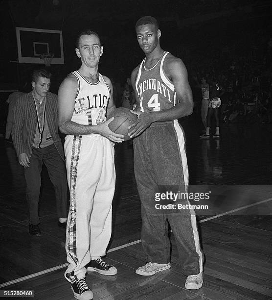 Cincinnati Royals' star attraction Oscar Robertson poses with Boston Celtics ace Bob Cousy before their game at Boston Garden 11/5. Robertson led the...