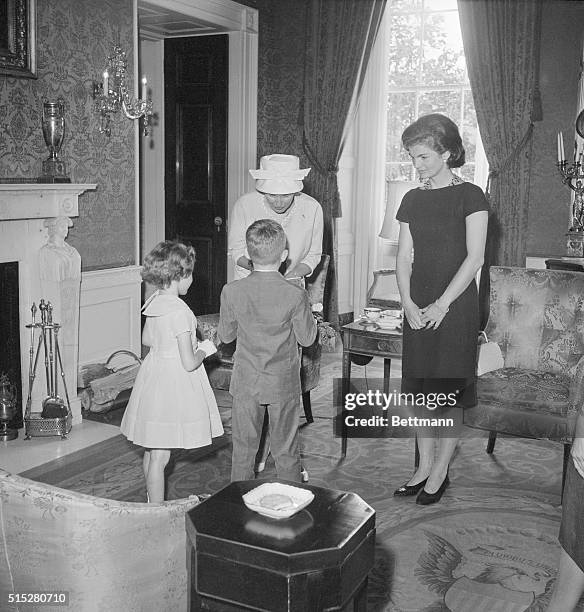 Mrs. John F. Kennedy, First Lady of the United States, and Mrs. Alan B. Shepard, Jr., America's "First Lady of Space," pose at the White House here...