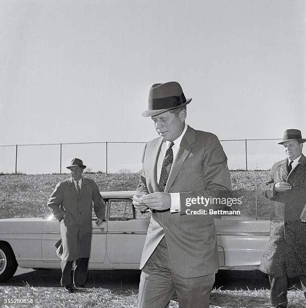 President-elect John F. Kennedy wears a fedora as he heads for Georgetown Hospital in Washington, DC, to visit his wife and newborn son.