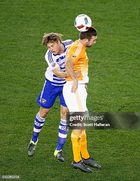 Will Bruin of the Houston Dynamo battles for the ball with Walker Zimmerman of FC Dallas during their game at BBVA Compass Stadium on March 12, 2016...