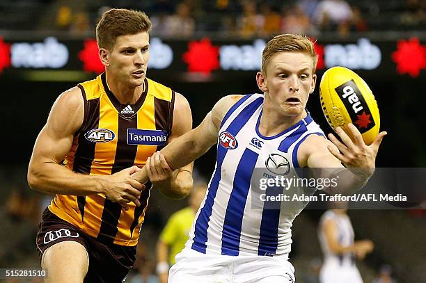 Jack Ziebell of the Kangaroos and Luke Breust of the Hawks compete for the ball during the 2016 NAB Challenge match between the Hawthorn Hawks and...