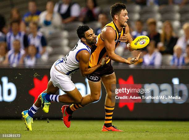 Jack Gunston of the Hawks is tackled by Lindsay Thomas of the Kangaroos during the 2016 NAB Challenge match between the Hawthorn Hawks and the North...