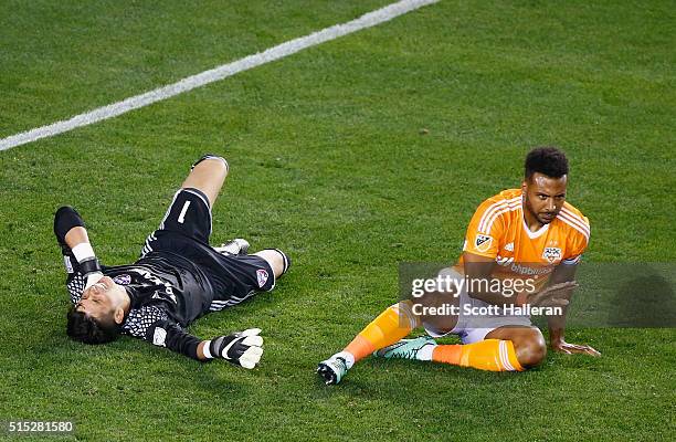 Jesse Gonzalez of FC Dallas and Giles Barnes of the Houston Dynamo wait on the pitch after colliding during their game at BBVA Compass Stadium on...