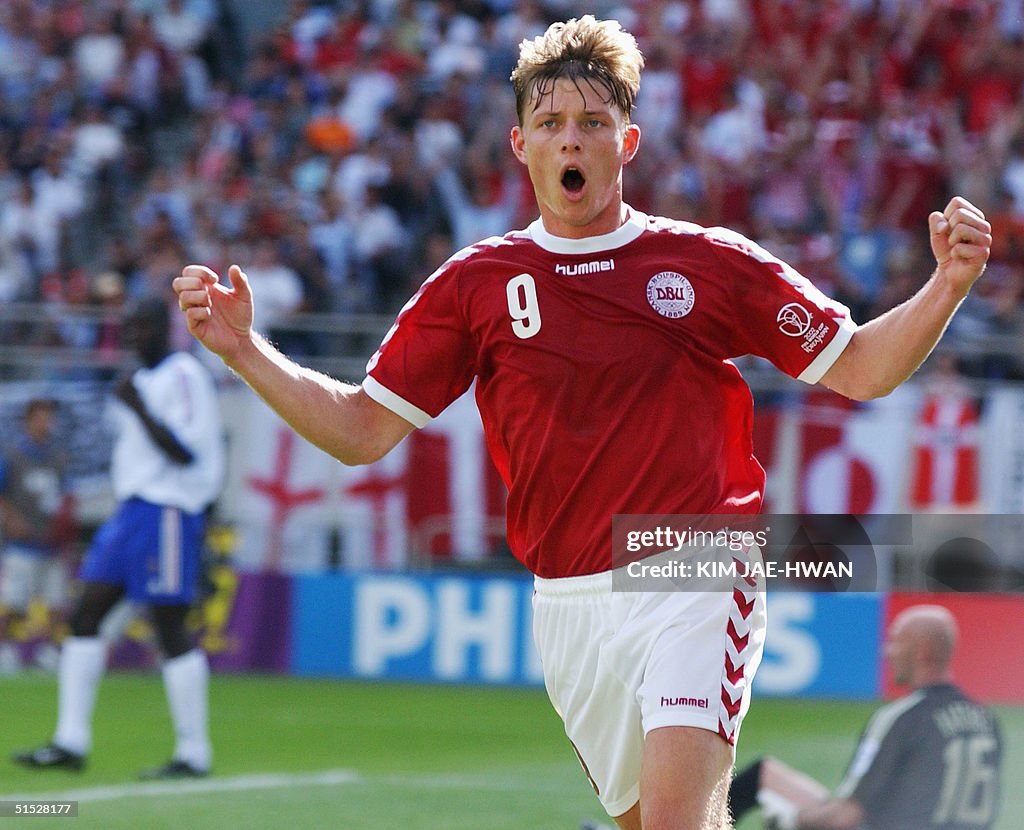 Denmark's Jon Dahl Tomasson celebrates after his 6
