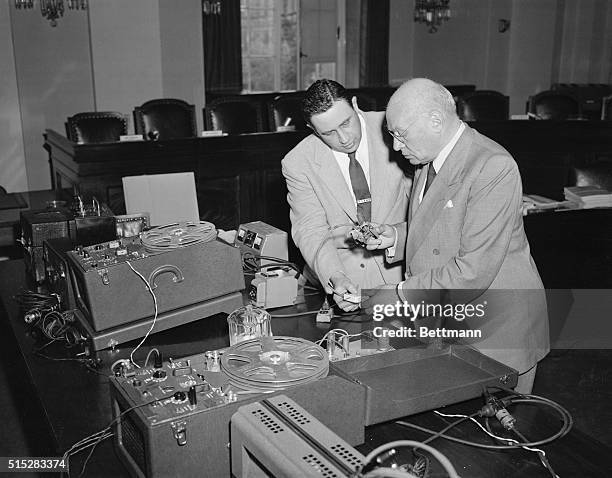 Washington, DC: Electronics expert Bernard Spindel, left of New York City, is shown as he gave Chairman Emanuel Celler of the House Judiciary...