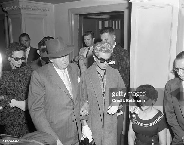 Los Angeles, California: On their way to the coroner's inquest into the death of Johnny Stompanato are Mrs. Mildred Turner, mother of screenstar Lana...