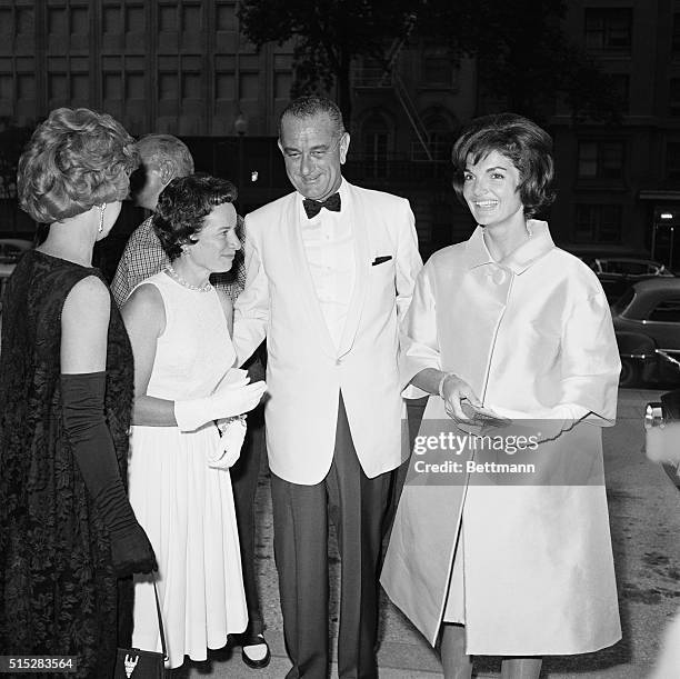 Mrs. Jacqueline Kennedy is shown here tonight with Vice President Lyndon Johnson as they arrive to attend the Women's National Press Club's annual...