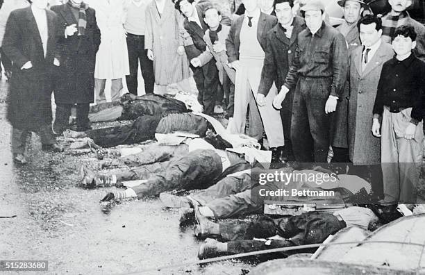 Bomb Victims in Buenos Aires. Buenos Aires, Argentina: Laid out in a row here are some of the victims of the bombing of Buenos Aires by rebel planes...