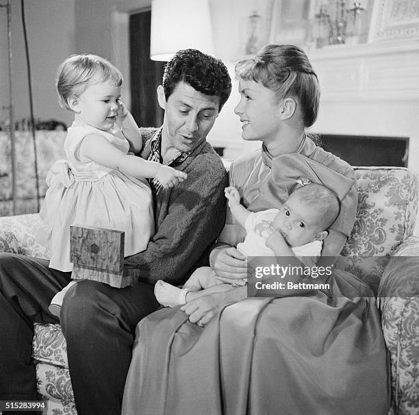 Family Portrait of the Fishers. Hollywood, Calif.: Singer Eddie Fisher and his actress wife, Debbie Reynolds, are shown in a happy family scene with...