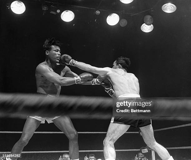 These unusual camera angle shots of last night's fight in Chicago Stadium in which Sugar Ray Robinson emerged Champion in the Middle-Weight division...