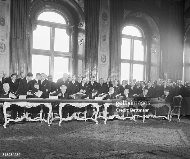 Delegates sign a peace treaty restoring independence to Austria.