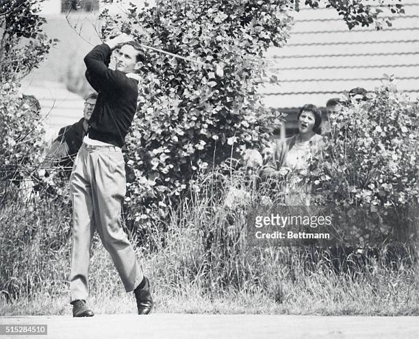 The winner. Lytham St. Annes, England: Watched by fans behind bushes, left-handed golfer Bob Charles of New Zealand drives on 14th hole during first...