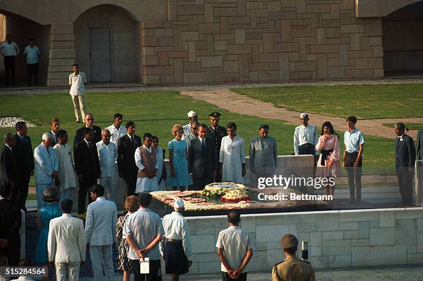 President Richard Nixon pays homage at the shrine of Mahatma Gandhi here July 31st. Mrs. Nixon also attended the ceremony, along with Indian...