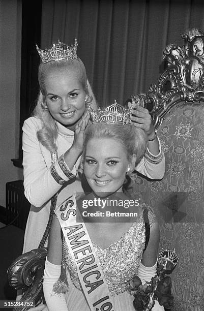 Pamela Eldred of Detroit, Michigan, is crowned Miss America 1970 by deposed queen Judith Ford. This year's Miss America pageant was held at Atlantic...