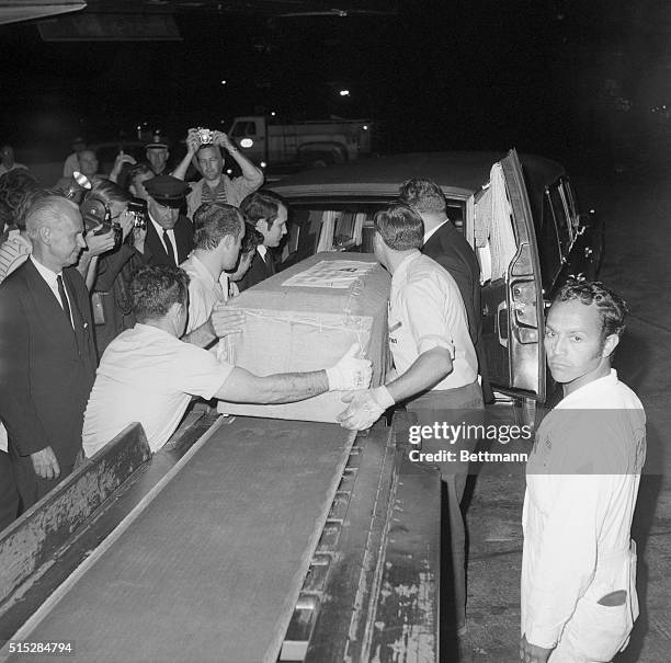 The casket containing the body of singer-actress Judy Garland is placed into a hearse at airport here early June 26th after arrival from London....