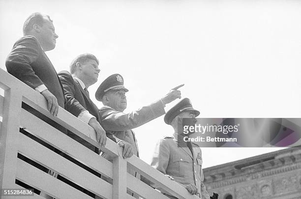 West Berlin Mayor Willy Brandt, President Kennedy, and Major Generals Frederick O. Hartel and Major General James Polk look into East Berlin from...
