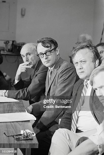 Cambridge, Massachusetts: Three serious faced Harvard University professors listen to question at news conference , after a special faculty-student...