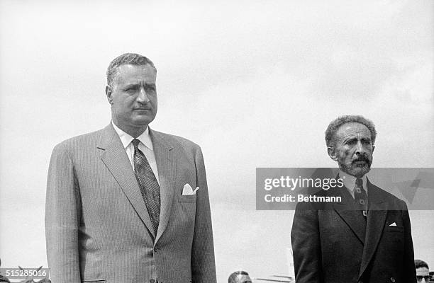 United Arab Republic President Gamal Abdel Nasser, is accompanied by Ethiopian Emperor Haile Selassie, as they leave airport here, following Nasser's...