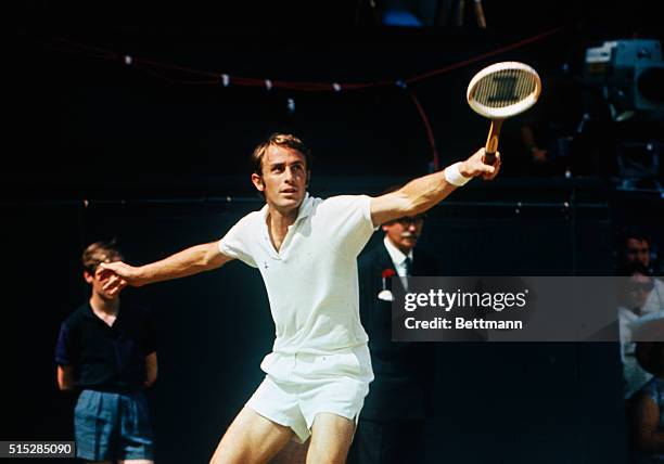 Wimbledon, England: Australian John Newcombe, battling it out against left-hander Rod Laver on the famous center court in the Men's Singles Tennis...