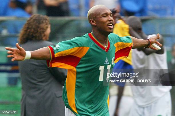 Senegal's forward El Hadji Diouf celebrates after Senegal qualified for the quarterfinals, winning 2-1 against Sweden in overtime of match 51 round...