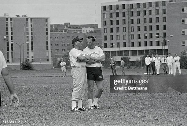 Washington Redskin coach Vince Lombardi with coach Sam Huff during first day's training.