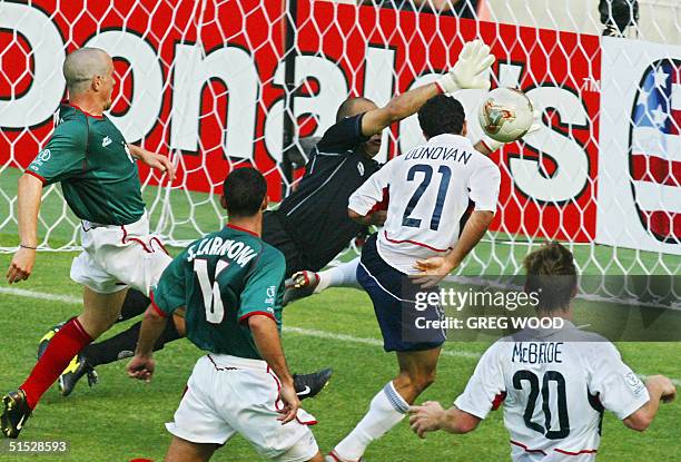 S Landon Donovan scores off a header in the 65th minute past an outstretched Oscar Perez in goal for Mexico , 17 June 2002 at the Jeonju World Cup...