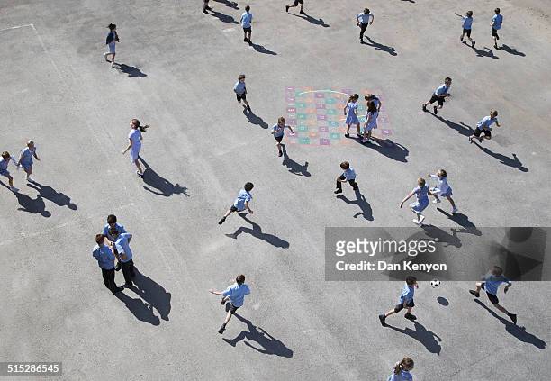 children running on playground - liverpool england stock-fotos und bilder