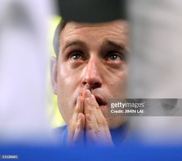 An Italian supporter cries following his team's loss in extra time to South Korea in the second round of the 2002 FIFA World Cup Korea/Japan in...
