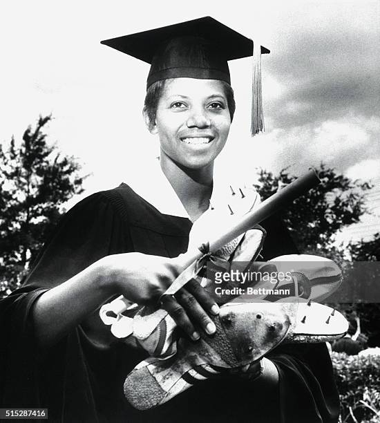 Nashville, TN-ORIGINAL CAPTION READS: "TRACK SHOES FOR DIPLOMA"- Miss Wilma Rudolph, Olympic Gold Medal Winner and track star, received her diploma...