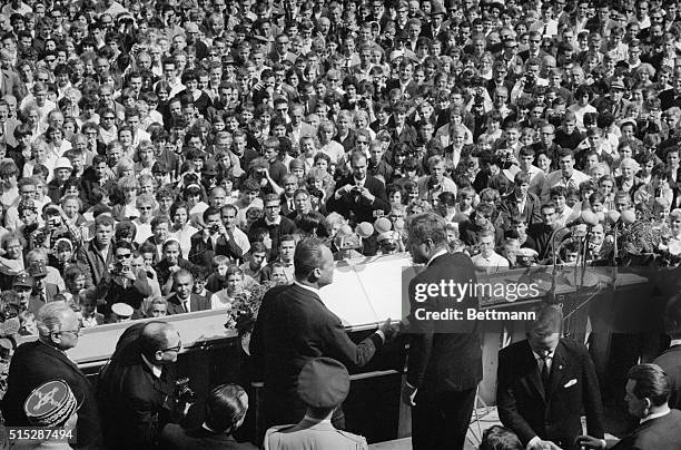 Berlin: A symbolic thank you handshake marks the end of a ceremony in Berlin city hall and appreciation of Berliner's for Kennedy's visit to the...