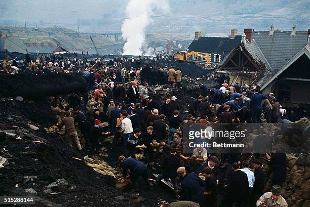 Aberfan, Wales: Hundreds of rescue workers dig into a huge pile of rubble after thousands of tons of coal pit waste slid down onto this village in...