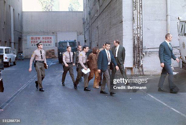 Los Angeles: Charles Manson, accused leader of a hippie cult charged with the Tate-LaBianca murders, is heavily guarded as he leaves the Hall of...