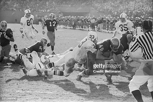 Jack Ham plays for Pennsylvania State University in 1969. A player for University of Pittsburgh drags Jack Ham with him as he scores touchdown.