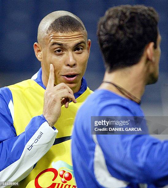 Brazil's forward Ronaldo Nazario jokes with Edmilson 24 June 2002 during an afternoon training session at Saitama stadium. Turkey pose a bigger...