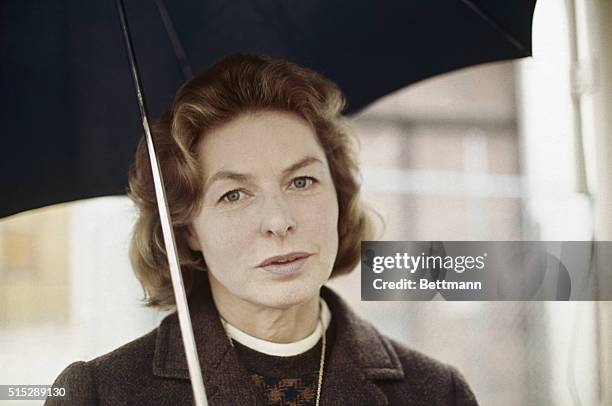 Hollywood, California: Actress Ingrid Bergman leaves Columbia Pictures after a hard day on the set of Cactus Flower, in a rare Los Angeles rain.