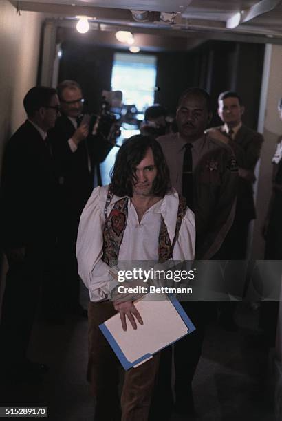 Charles Manson enters Los Angeles county court in the Sharon Tate murder case, where he is acting as his own attorney. Manson is charged with seven...