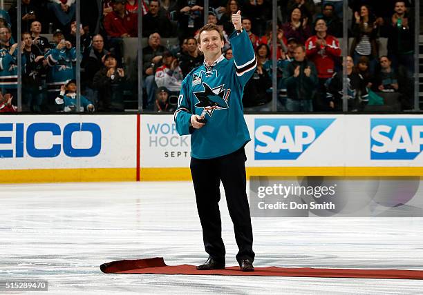 Evgeni Nabokov an alum of the San Jose Sharks is honored with the puck drop before the game against the Washington Capitals during a NHL game at the...