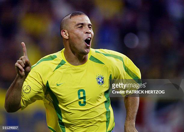 Brazil's forward Ronaldo celebrates after scoring the first goal against Turkey during the semi-final match of the FIFA 2002 World Cup Korea Japan 26...
