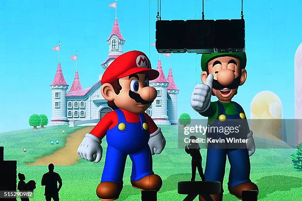 Images of Mario and Luigi from the Mario Bros. Video game franchise appear on a video screen onstage during Nickelodeon's 2016 Kids' Choice Awards at...